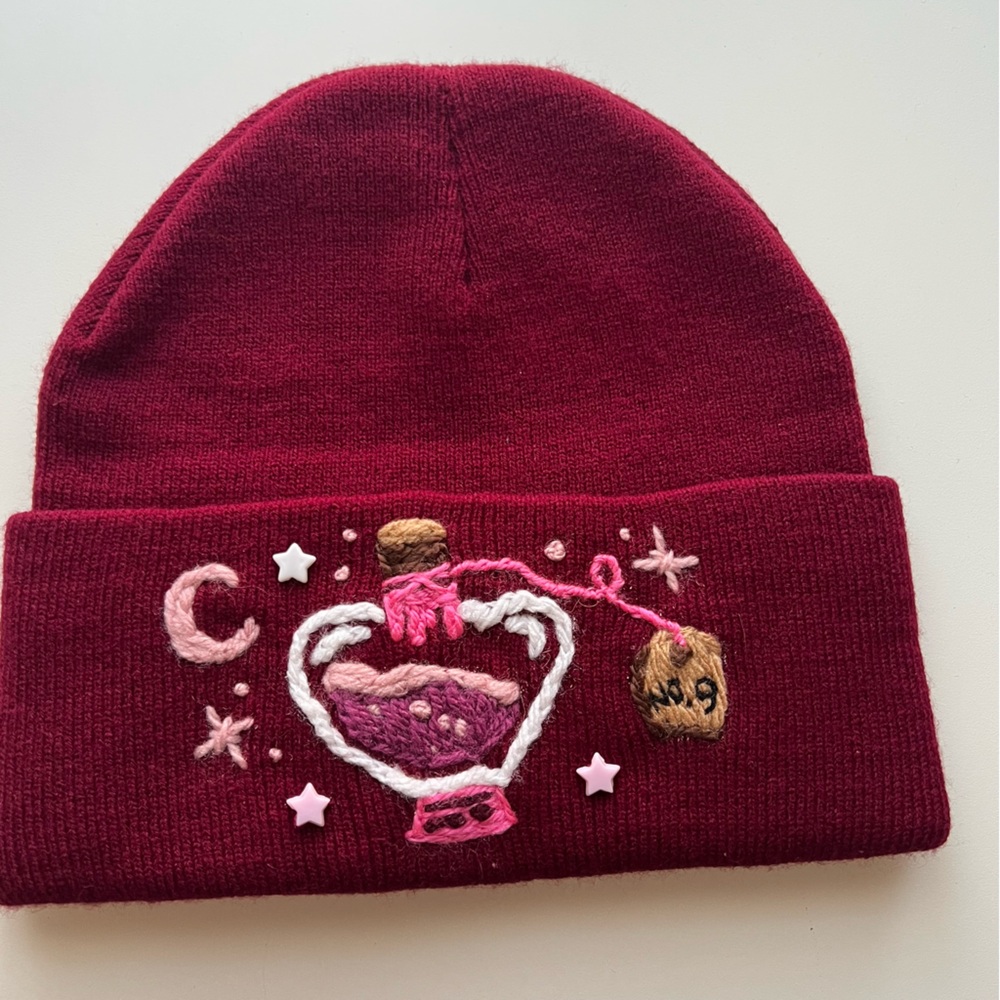 Maroon Knit Beanie with Embroidered Design Potion No 9